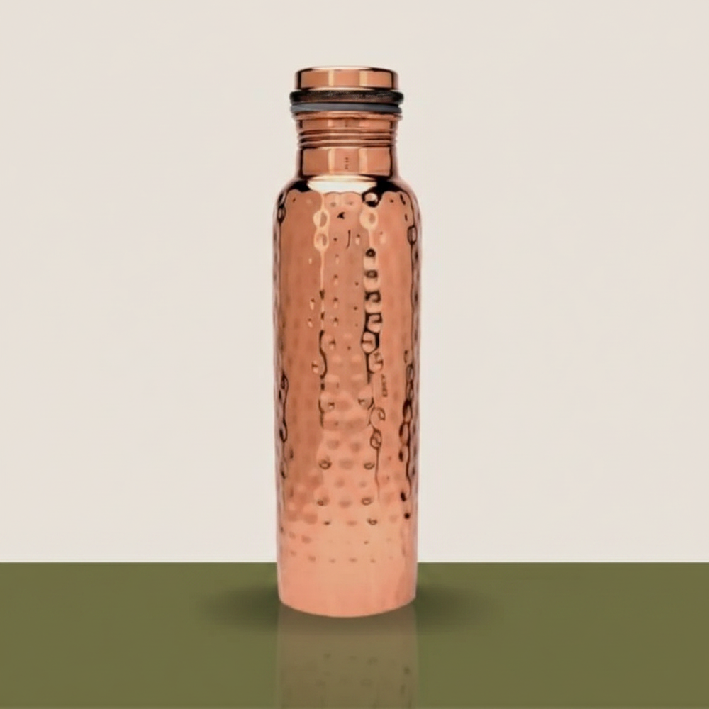 A pure copper Ayurvedic water bottle stands angled on a subtle gradient background, illuminated by soft light.